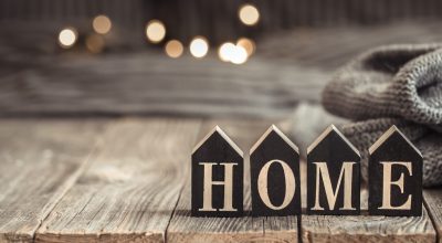 Cozy background with wooden letters with the inscription home . The concept of home atmosphere and comfort.